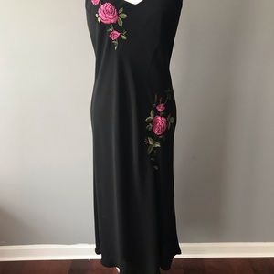 Black dress with pink floral appliqué